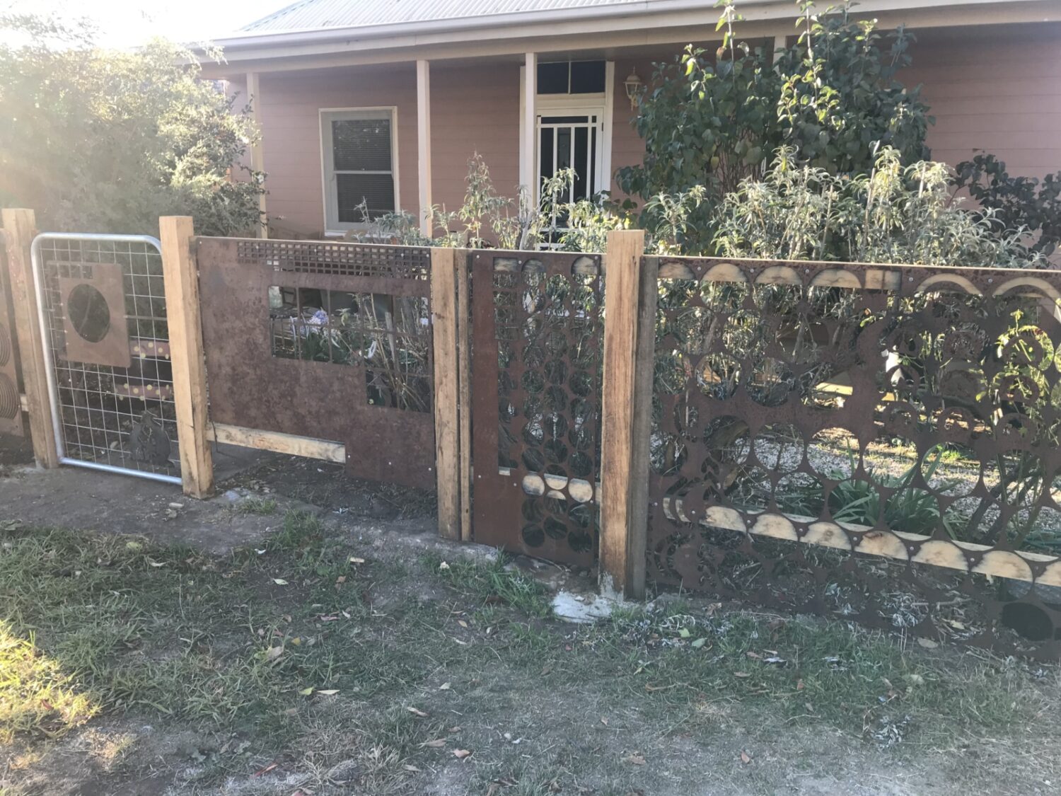 Front-fence-showing-recycled-iron-offcuts-scaled