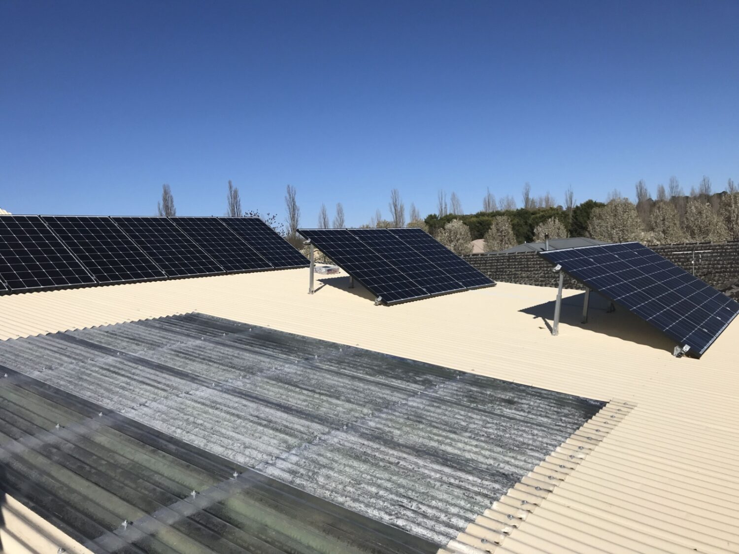 Installing-solar-panels-set-for-maximum-at-winter-solistice-scaled