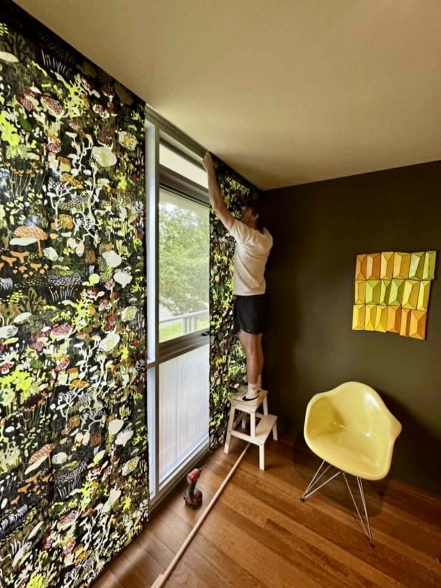 Hanging-curtains-on-window-with-internal-secondary-glazing-applied-to-lower-part