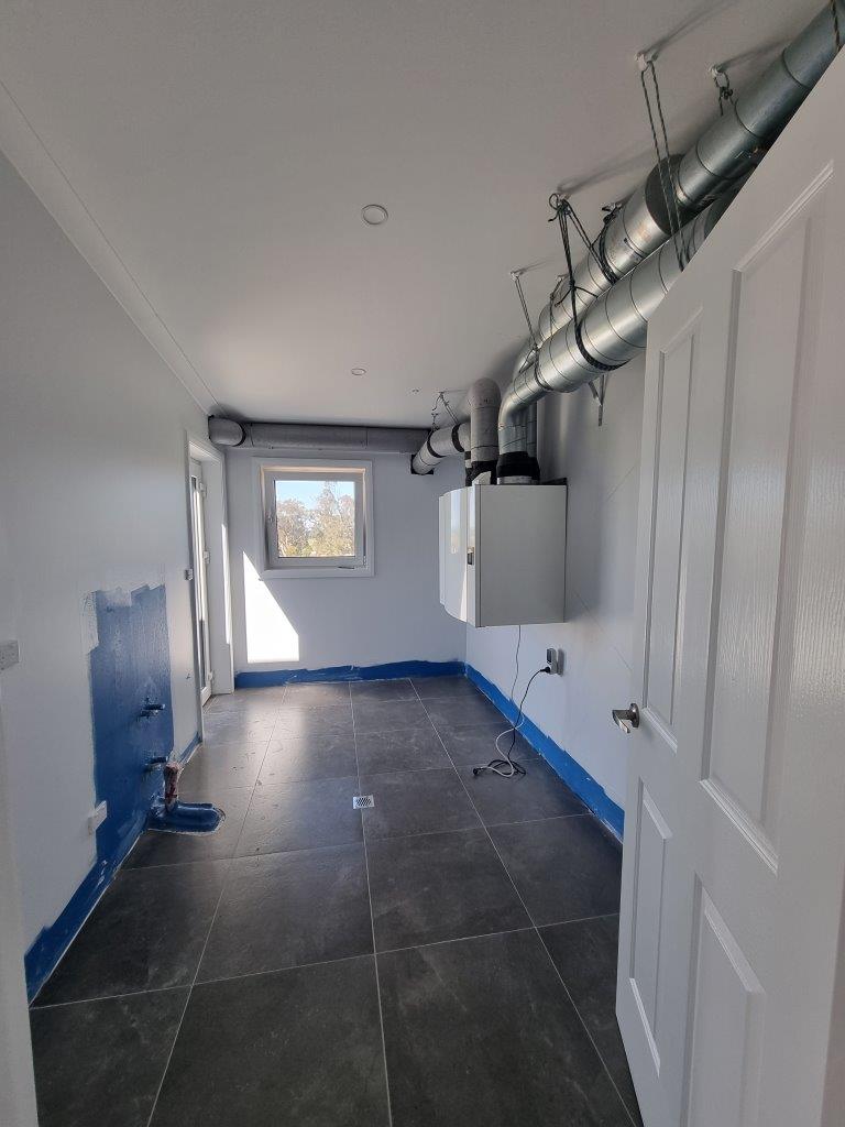 Laundry with heat recovery ventilation