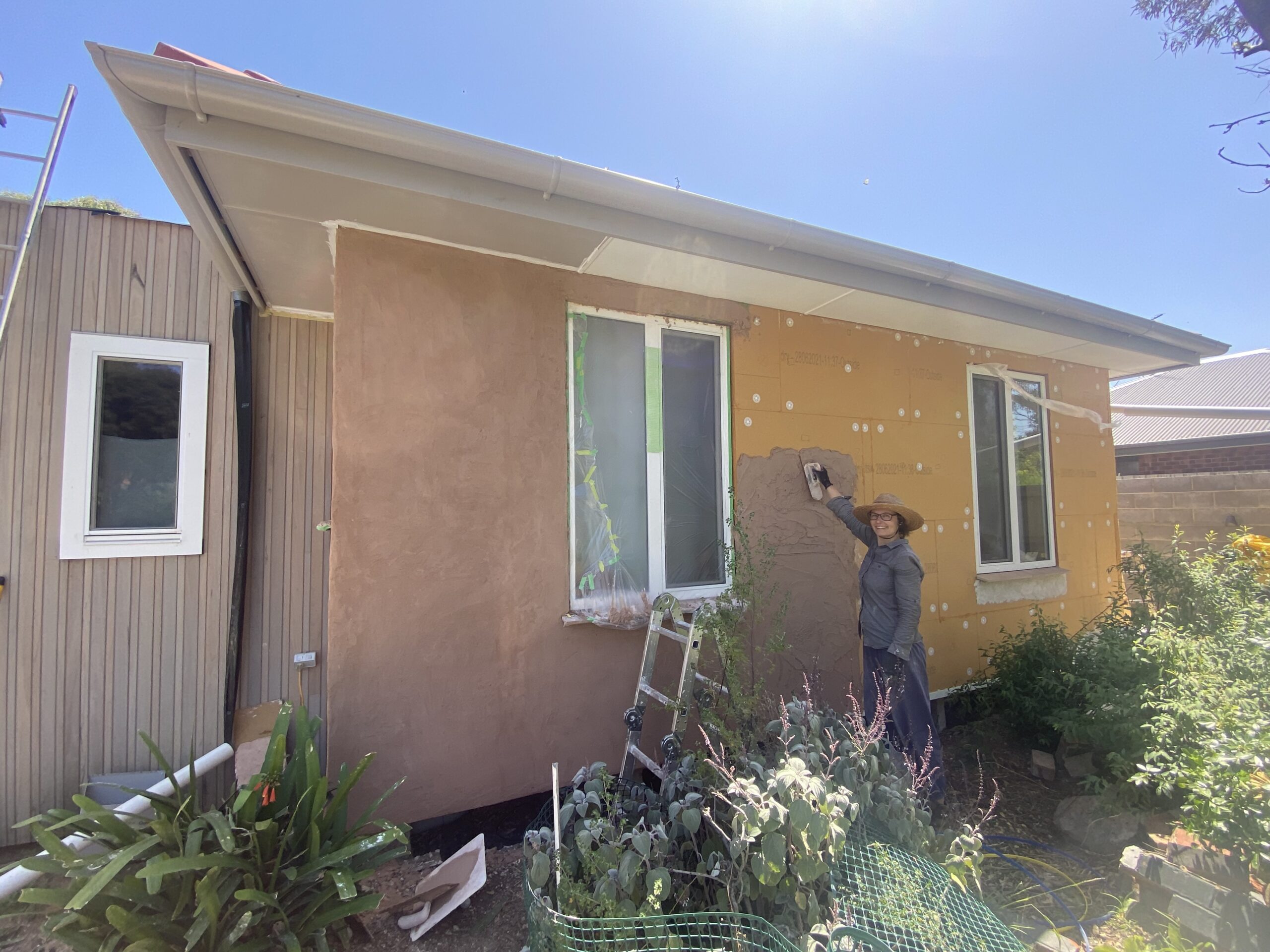 Lime render over woodfibre board insulation on external original concrete walls IMG_8237 2