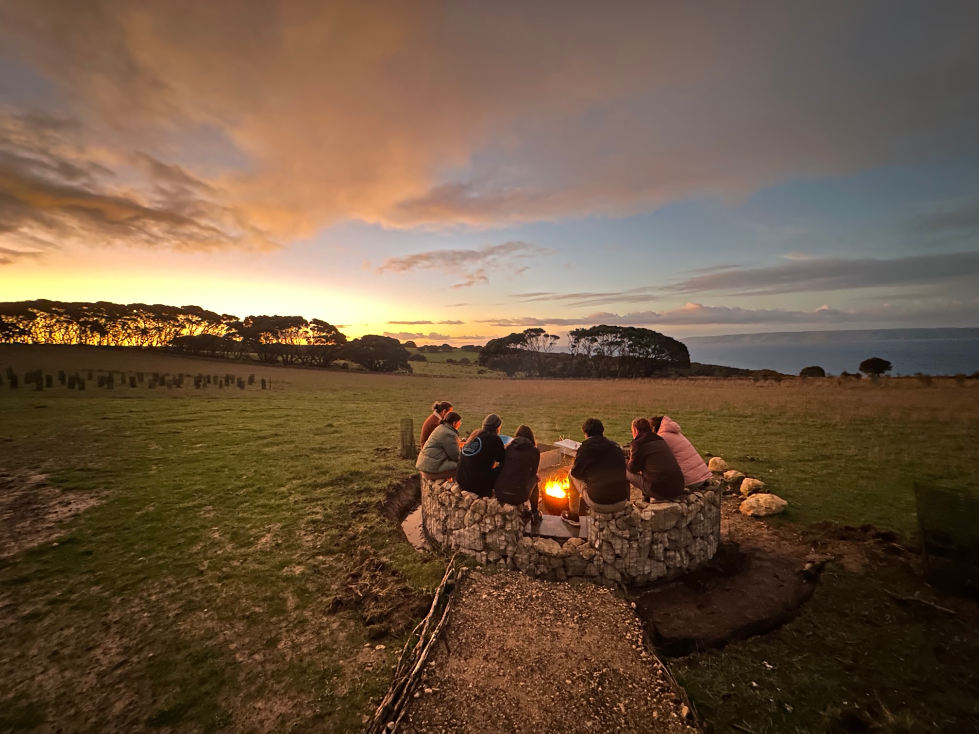 Sunset-group-around-fire-pit